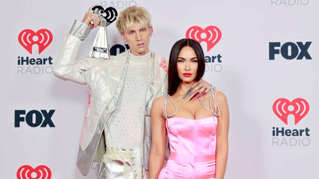 Machine Gun Kelly, winner of the Alternative Rock Album of the Year award for 'Tickets To My Downfall,’ and Megan Fox attend the 2021 iHeartRadio Music Awards at The Dolby Theatre in Los Angeles, California, which was broadcast live on FOX on May 27, 2021.