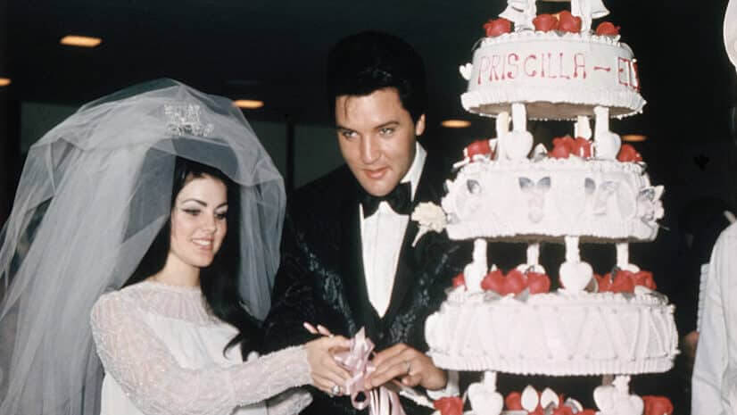 (Original Caption) Las Vegas, Nevada, Entertainer, Elvis Presley cuts wedding cake with his bride, the former Priscilla Ann Beaulieu, May 1, 1967.