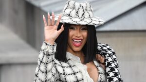 US rapper Cardi B waves as she arrives prior to the Chanel Women's Spring-Summer 2020 Ready-to-Wear collection fashion show at the Grand Palais in Paris, on October 1, 2019.