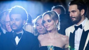 TOPSHOT - (From L) Canadian singer Abel Makkonen Tesfaye aka The Weeknd, French-US actress Lily-Rose Depp and US director Sam Levinson arrive for the screening of the film "The Idol" during the 76th edition of the Cannes Film Festival in Cannes, southern France, on May 22, 2023.