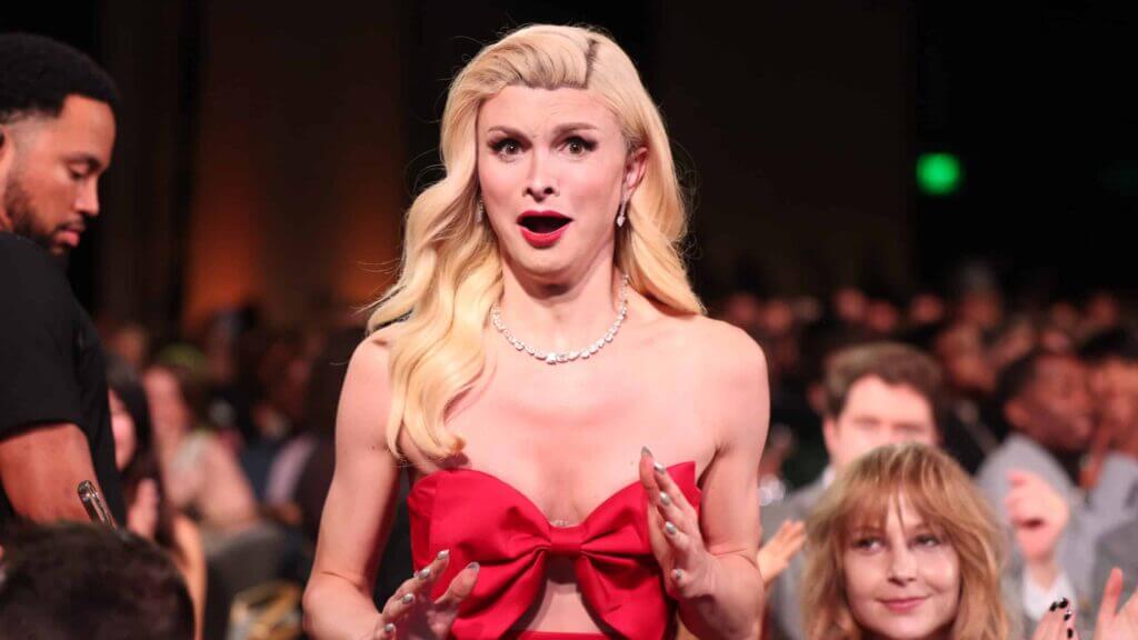 TikToker Dylan Mulvaney looks shocked as she stands to accept her Streamy Award for Breakout Creator.