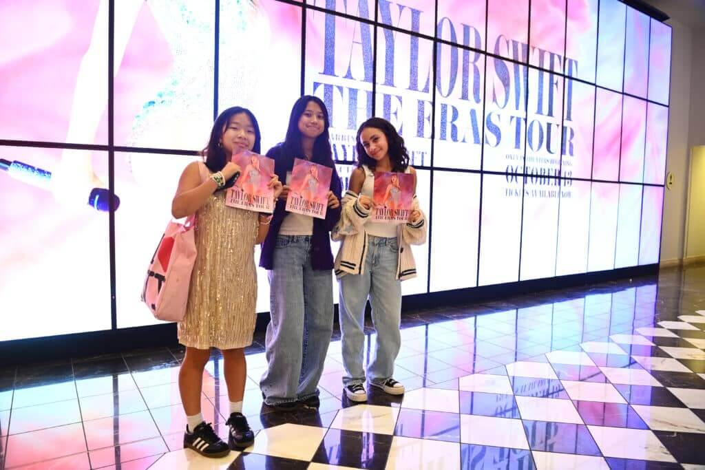GLENDALE, CALIFORNIA - OCTOBER 13: Taylor Swift fans, aka Swifties, are dressed as Taylor Swift and wear Taylor Swift concert tee shirts at The World Premiere of "Taylor Swift: The Eras Tour" on October 13, 2023 in Glendale, California.