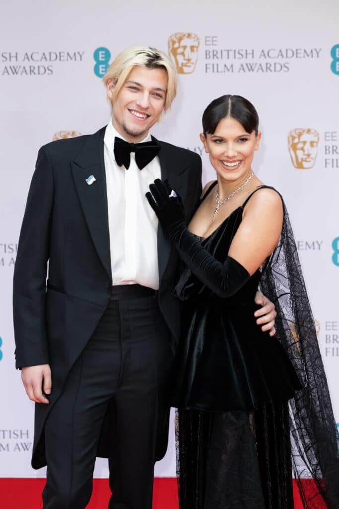Jake Bongiovi and Millie Bobby Brown attend the EE British Academy Film Awards 2022 at Royal Albert Hall on March 13, 2022 in London, England.