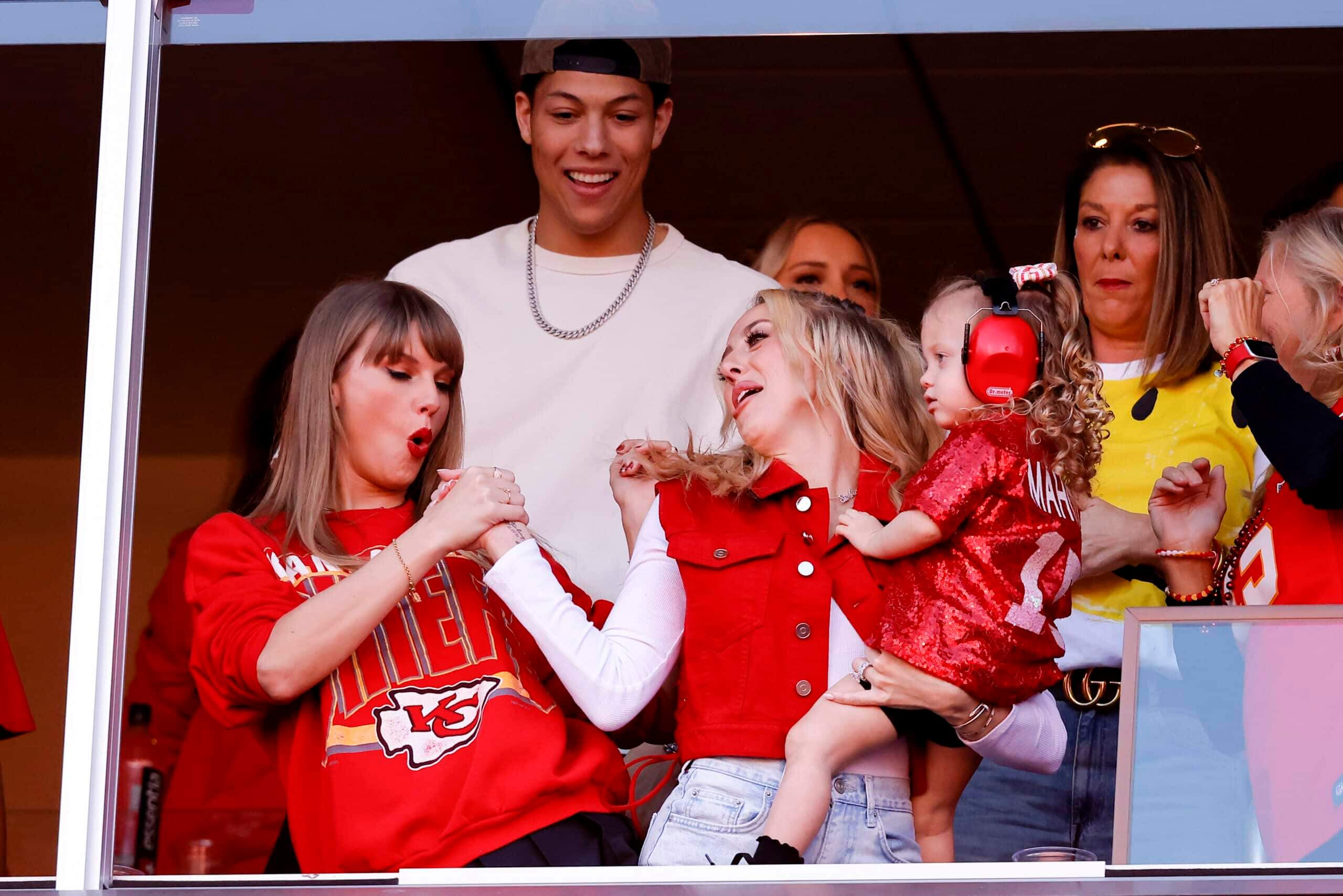 Taylor Swift and Brittany Mahomes celebrate a touchdown during the second quarter of the game between the Kansas City Chiefs and the Los Angeles Chargers at GEHA Field at Arrowhead Stadium on October 22, 2023 in Kansas City, Missouri. 