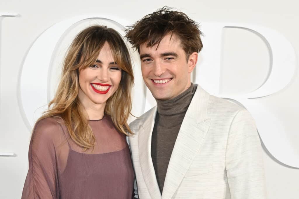 Suki Waterhouse and Robert Pattinson attend the Dior Fall 2023 Menswear Show on December 03, 2022 in Giza, Egypt.