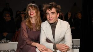 Suki Waterhouse and Robert Pattinson attend the Dior Fall 2023 Menswear Show on December 03, 2022 in Giza, Egypt.