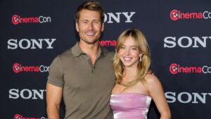 Glen Powell (L) and Sydney Sweeney promote the upcoming film "Anyone But You" at the Sony Pictures Entertainment presentation during CinemaCon, the official convention of the National Association of Theatre Owners, at The Colosseum at Caesars Palace on April 24, 2023 in Las Vegas, Nevada.