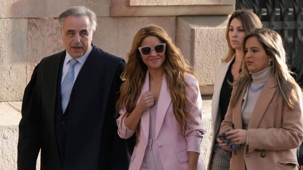 Colombian singer Shakira (2nd-L) arrives with her lawyer Pau Molins (L) at the High Court of Justice of Catalonia for her trial on tax fraud, in Barcelona on November 20, 2023. Colombian superstar Shakira goes on trial in Barcelona today in a tax fraud case, with Spanish prosecutors seeking a jail term of over eight years for the Grammy-winning singer. They accuse the 46-year-old of defrauding the Spanish state of 14.5 million euros ($15.7 million) on income earned between 2012 and 2014, charges denied by the singer who says she only moved to Spain full time in 2015. (Photo by Pau BARRENA / AFP)