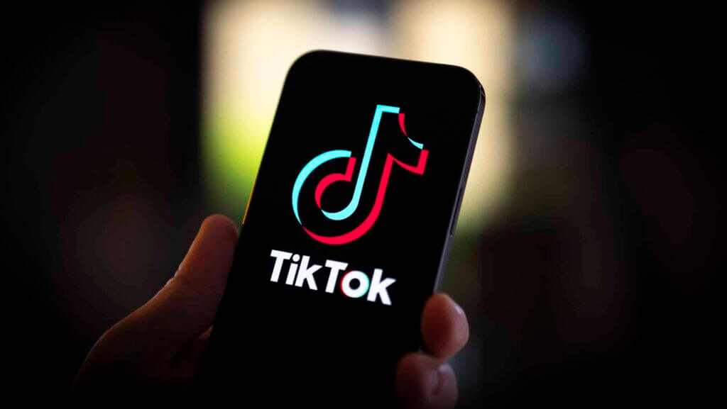 The TikTok logo is seen on a mobile device in this photo illustration in Warsaw, Poland on 20 July, 2023. (Photo by Jaap Arriens/NurPhoto via Getty Images)