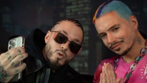 J Balvin pictured with his wax figure at Madame Tussauds.