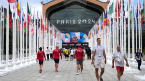 People walk in front of the Olympic village canteen for the Paris 2024 Olympic Games, in Paris, France, 22 July 2024.