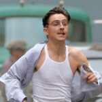 Timothee Chalamet was spotted sprinting through the streets of New York City while carrying a duffle bag during the filming of Marty Supreme. The actor was immersed in an intense scene for the upcoming project, showcasing his dynamic energy on set.