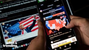 In this photo illustration, a person watch results of U.S. elections on a smartphone in Guwahati, India on 6 November 2024. Donald Trump has won the 2024 US presidential election and a second term in the White House, four years after losing the 2020.