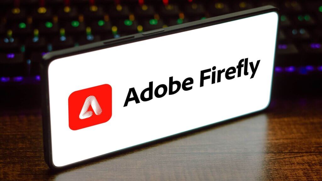 In this photo illustration, the Adobe Firefly logo is displayed on a smartphone screen.