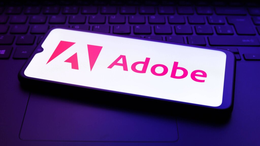 The Adobe Inc. logo appears on the screen of a smartphone in Reno, United States, on December 2, 2024.