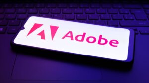 The Adobe Inc. logo appears on the screen of a smartphone in Reno, United States, on December 2, 2024.