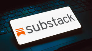 In this photo illustration, the Substack logo is displayed on a smartphone screen.