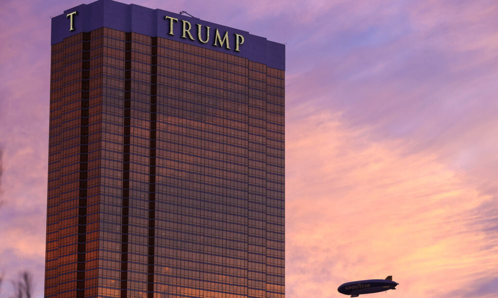 An exterior view of the Trump Hotel as the Goodyear Blimp passes by at sunset in Las Vegas, NV