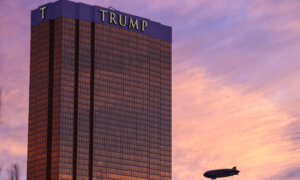 An exterior view of the Trump Hotel as the Goodyear Blimp passes by at sunset in Las Vegas, NV