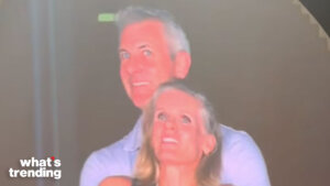 Couple smiling and embracing with "what's trending" logo in the corner