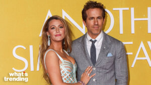 Blake Lively and Ryan Reynolds posing on the red carpet against a yellow backdrop with "what's trending" logo